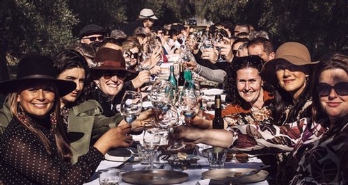 People enjoying a meal at Whispering Brook