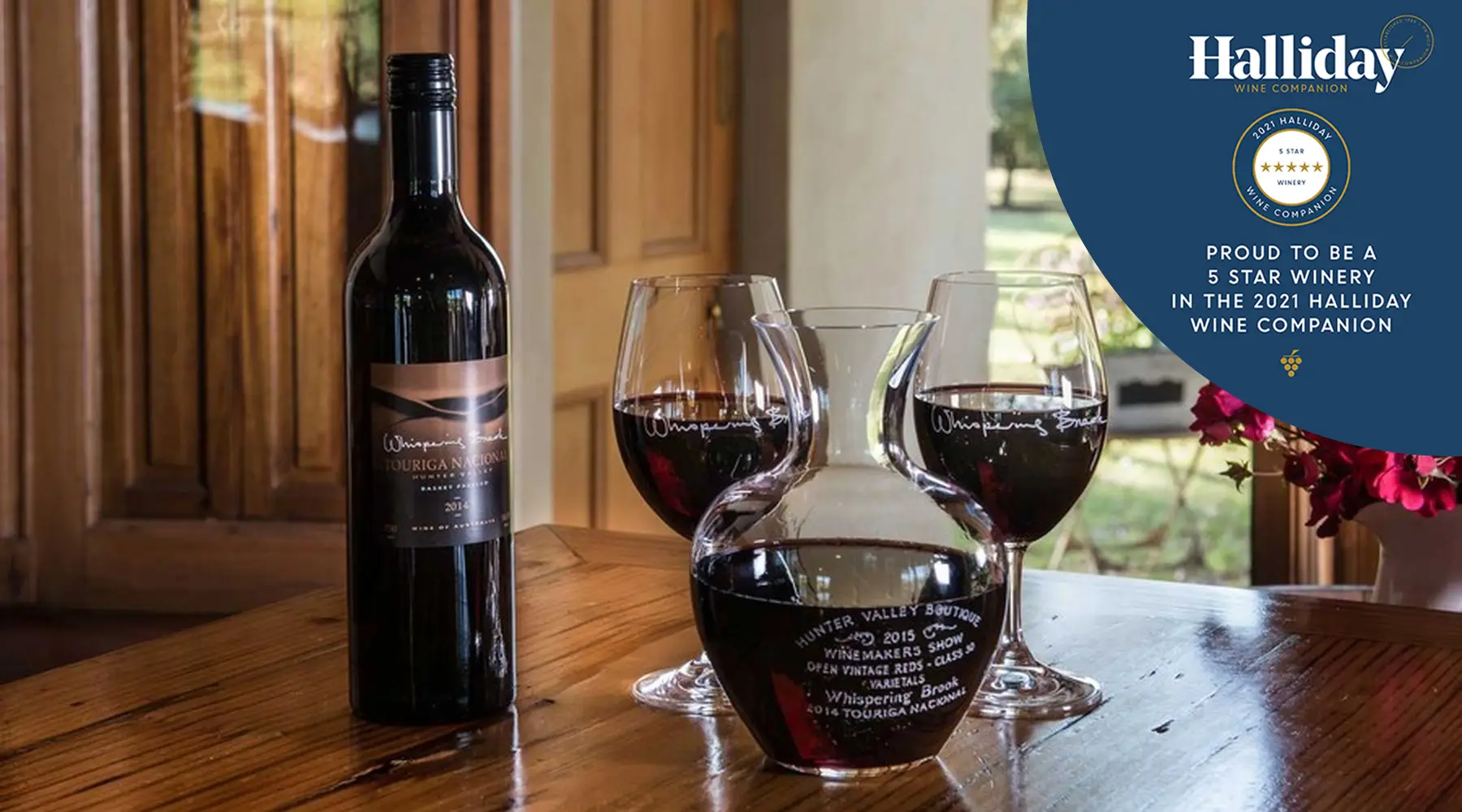 Whispering Brook wine glass and bottles with Halliday Badge
