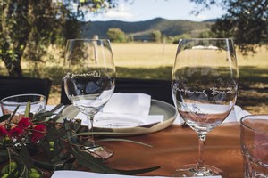 Wine glasses at a table outside